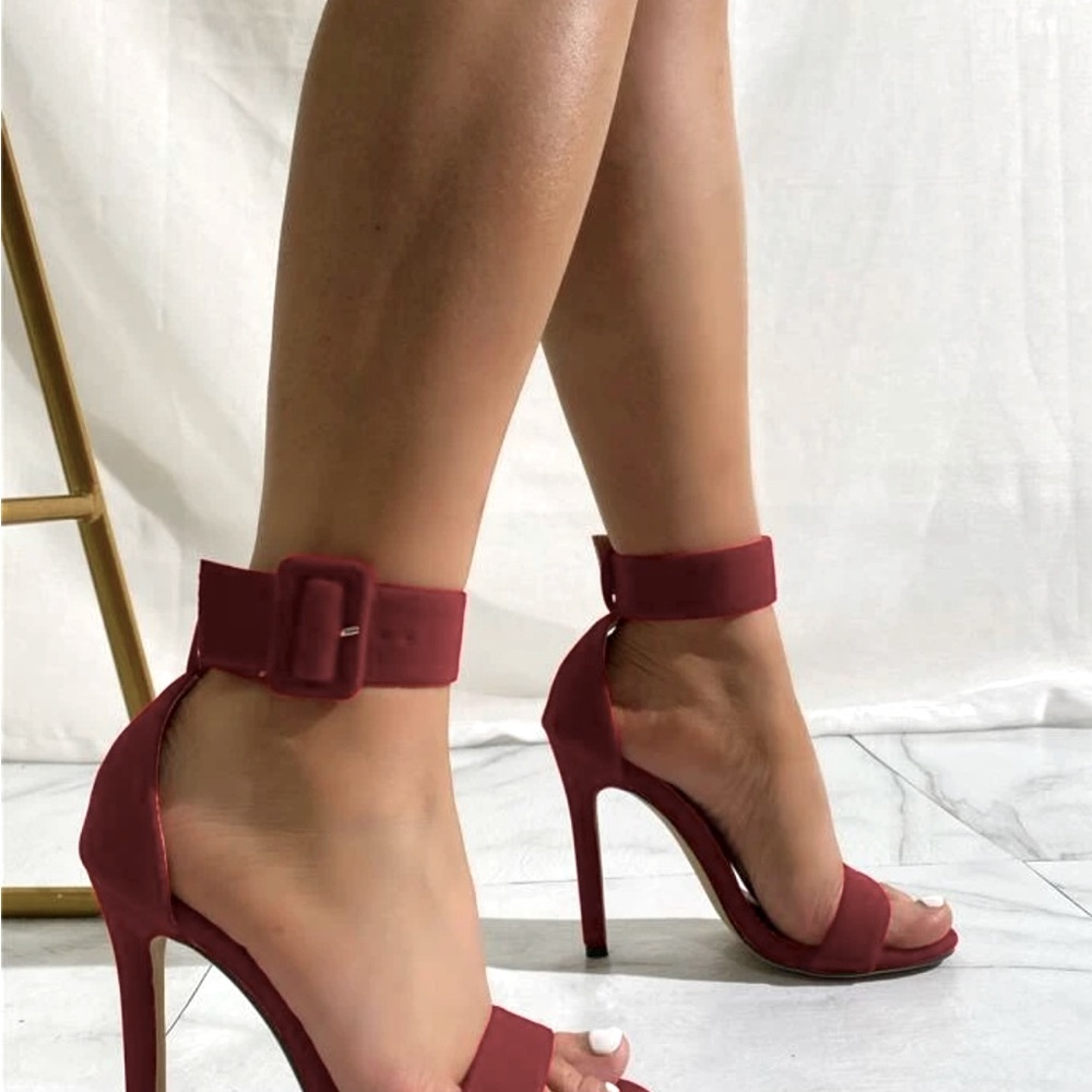 Red strapped heels with buckle